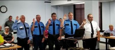 Waupun fire command staff raising hand to take oath of higher offices